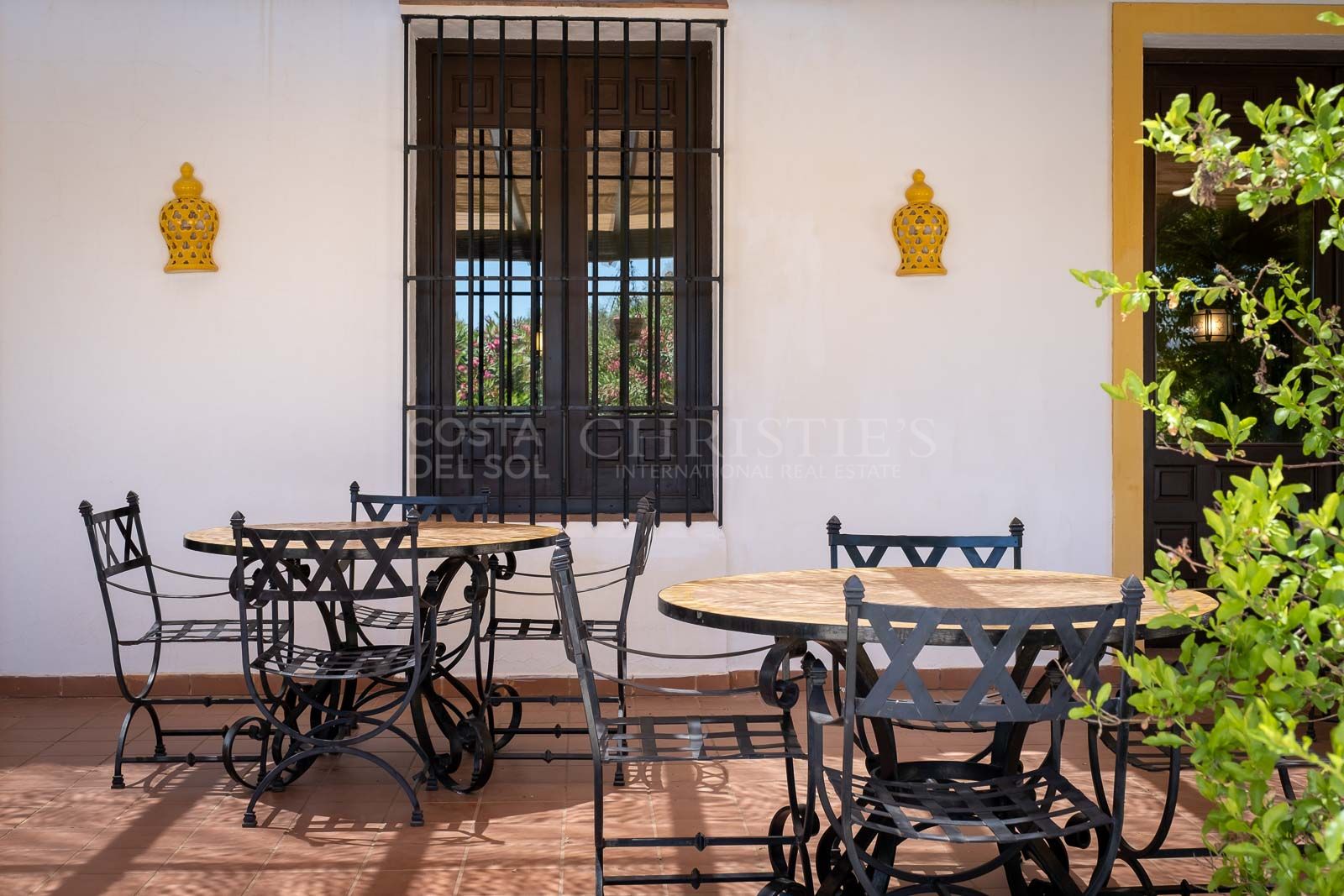 A comfortable living room, bar, dining room and terrace